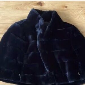 Faux fur shrug. Great accessory for any occasion. Only worn once.